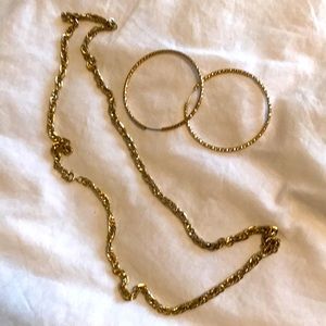Gold hoop earrings and chain necklace, costume.